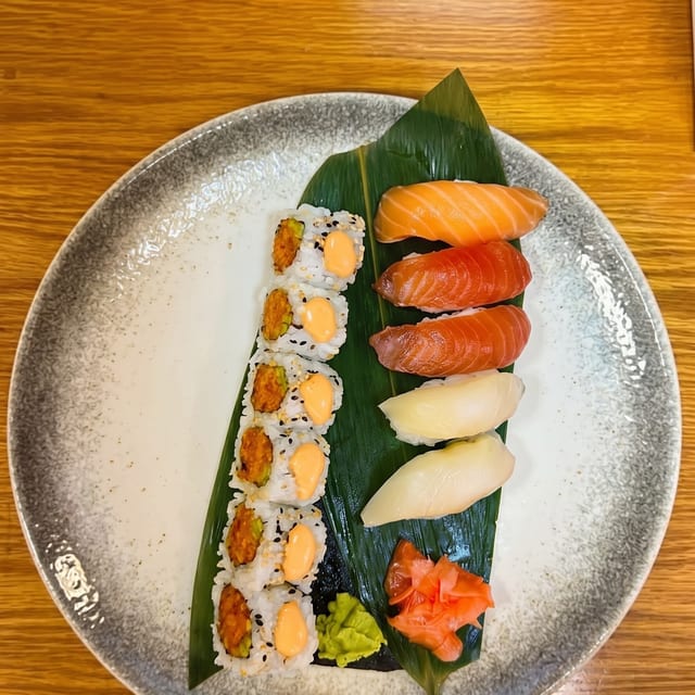 Nigiri Sushi and 1 Spicy Yellowtail or Spicy Tuna Roll.